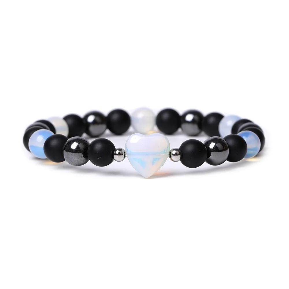 Hand-cut peach heart stone bracelet with geometric moon planet design in Tigereye colour