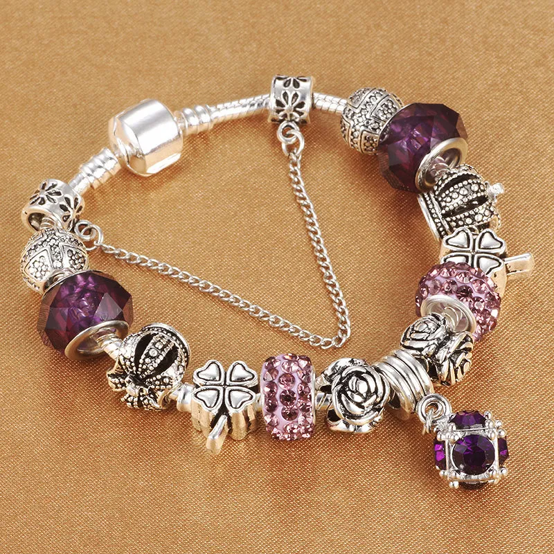 Multicolour beaded bracelet with alloy, glazed, and diamond beads on a white background