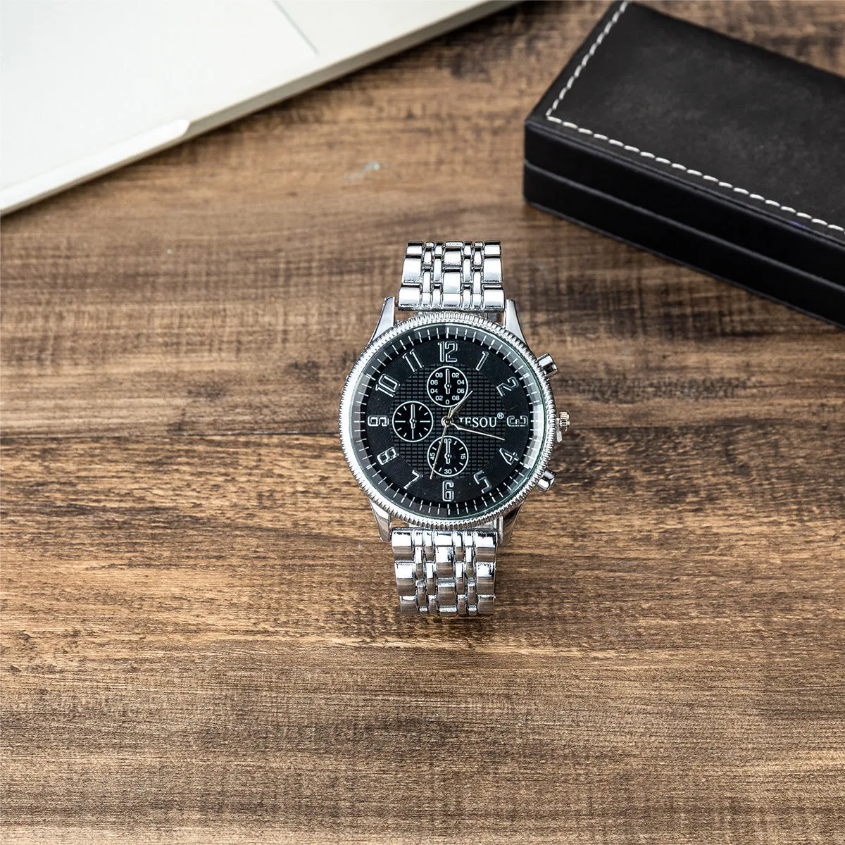 Steel band sport quartz watch with silver alloy case, stainless steel strap, and single fold buckle