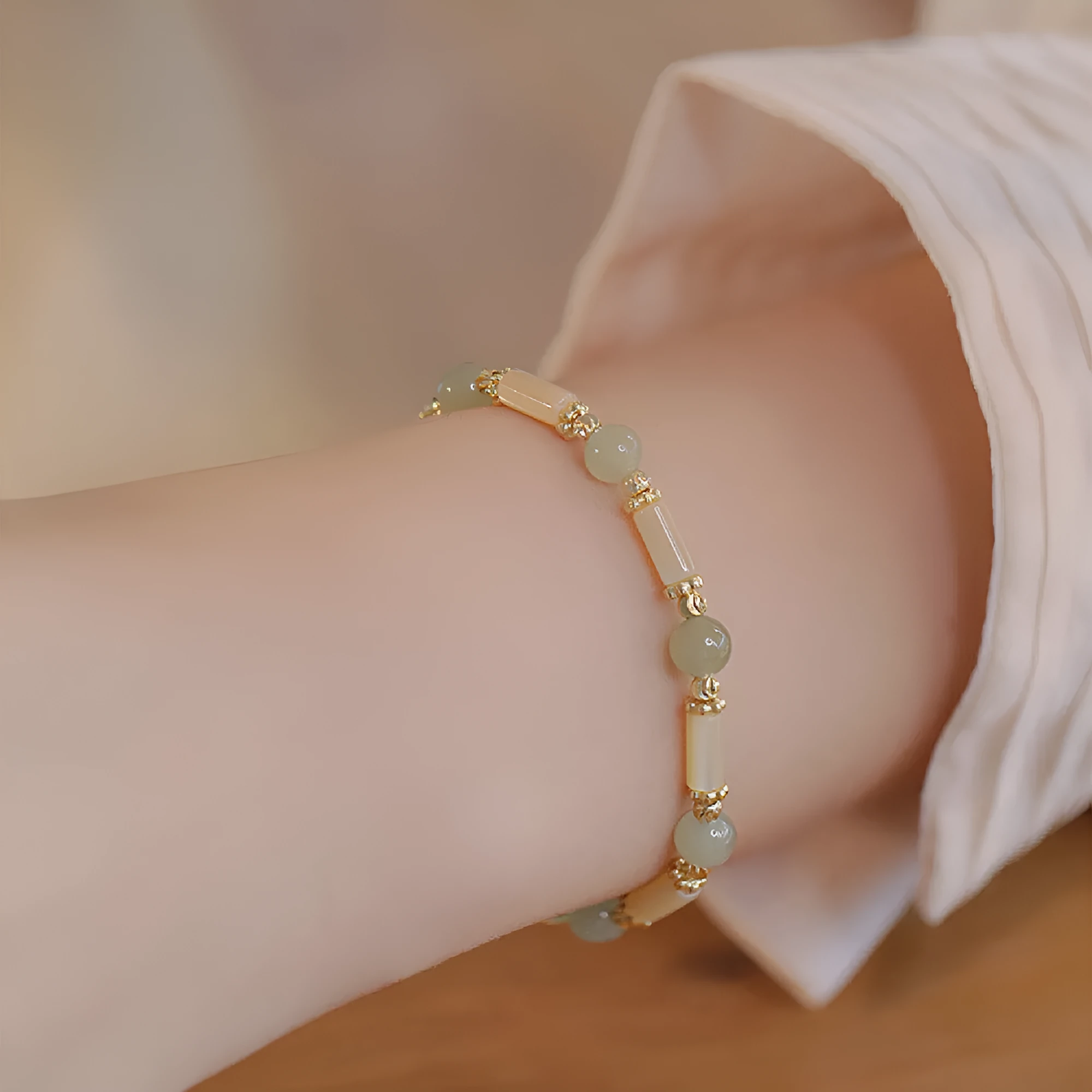 Casual women's bamboo joint bracelet made from 6mm Hetian jade beads in jade or red.