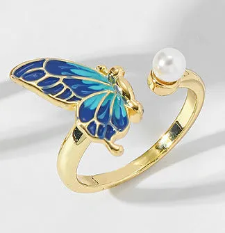 Butterfly-shaped pearl ring in imitation gold on adjustable alloy band