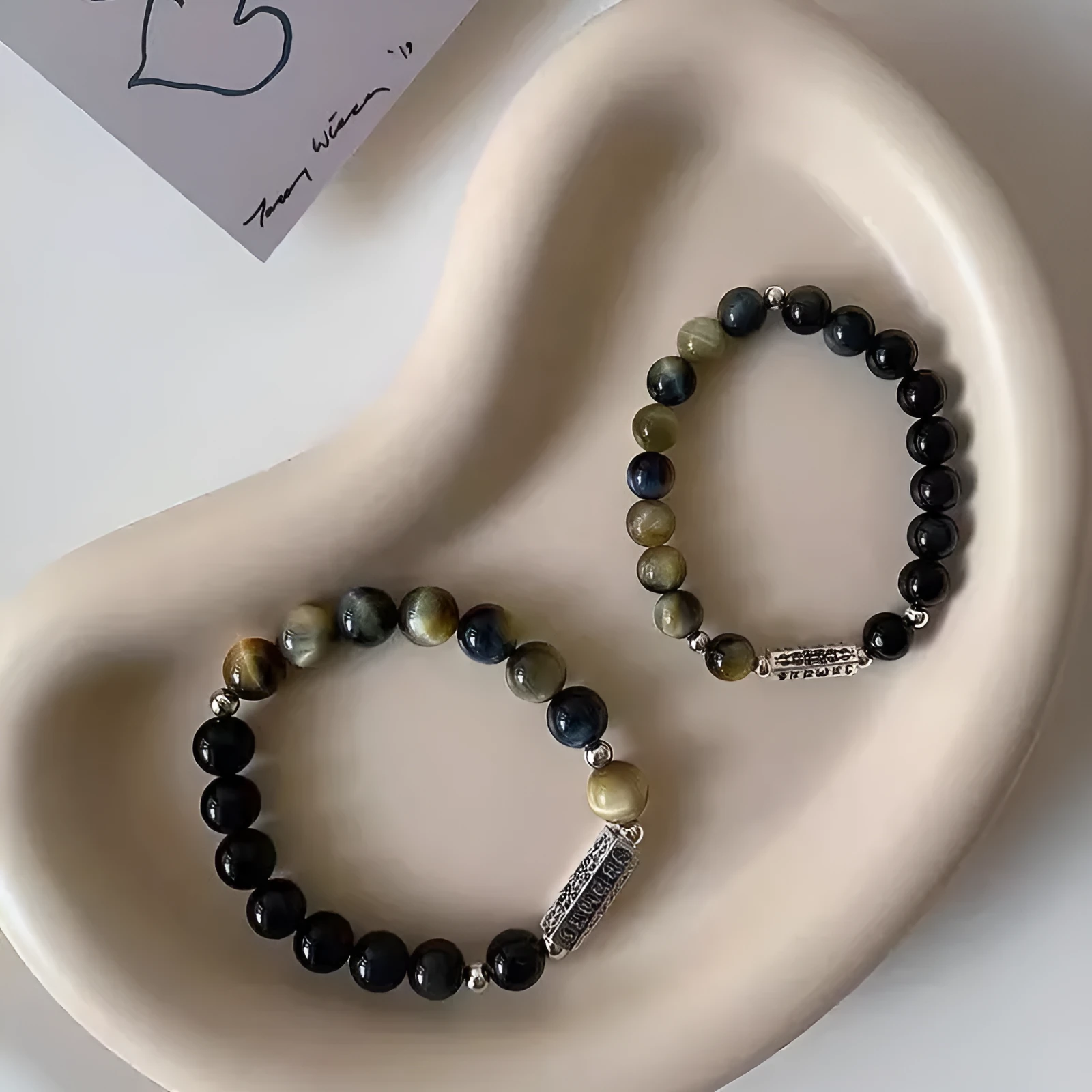 Sterling silver couple bracelet with tigereye obsidian gemstones and six words mantra design.