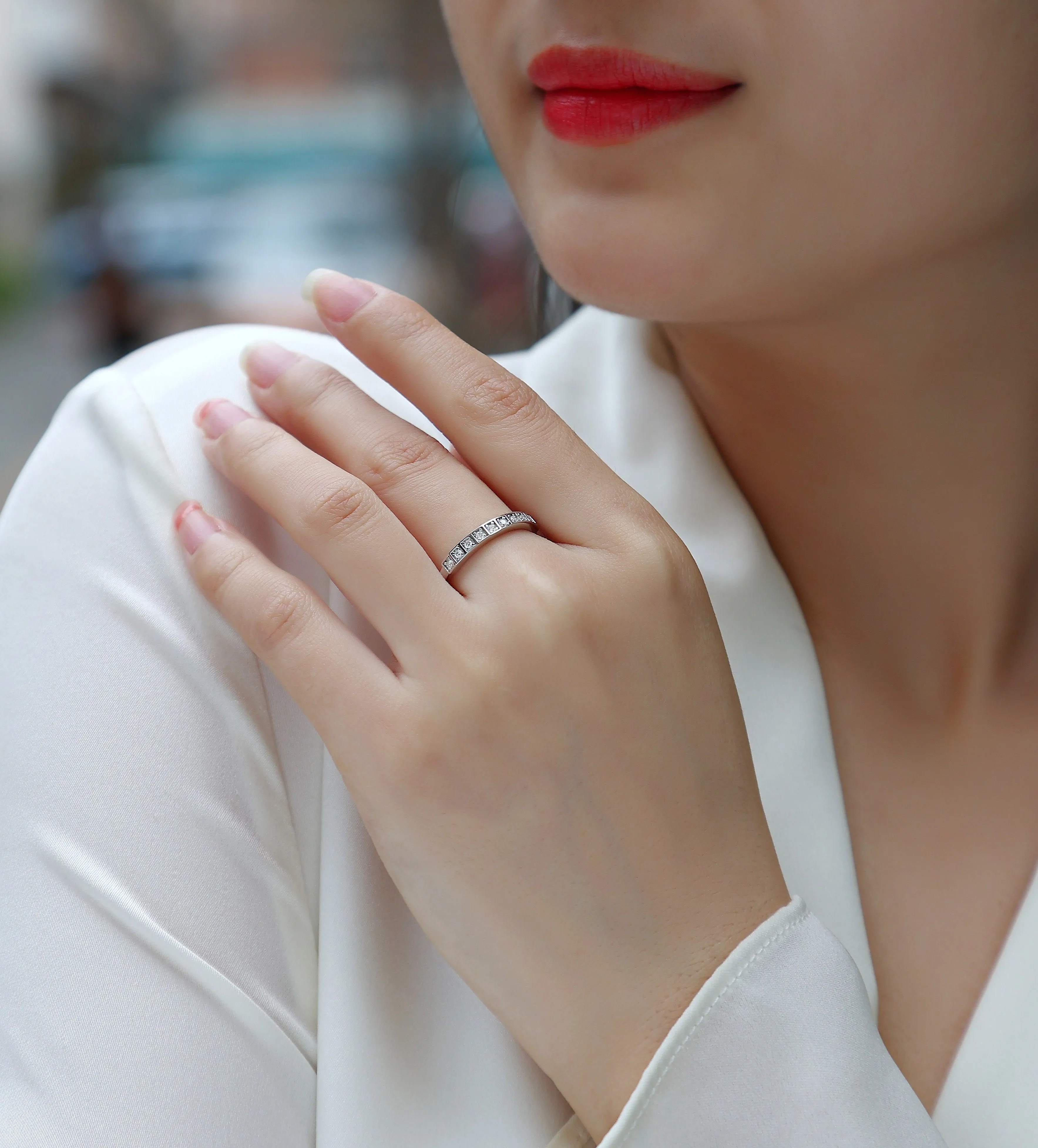 Moissanite wedding ring set on white background, S925 silver platinum plated, less than 0.1 carat stone