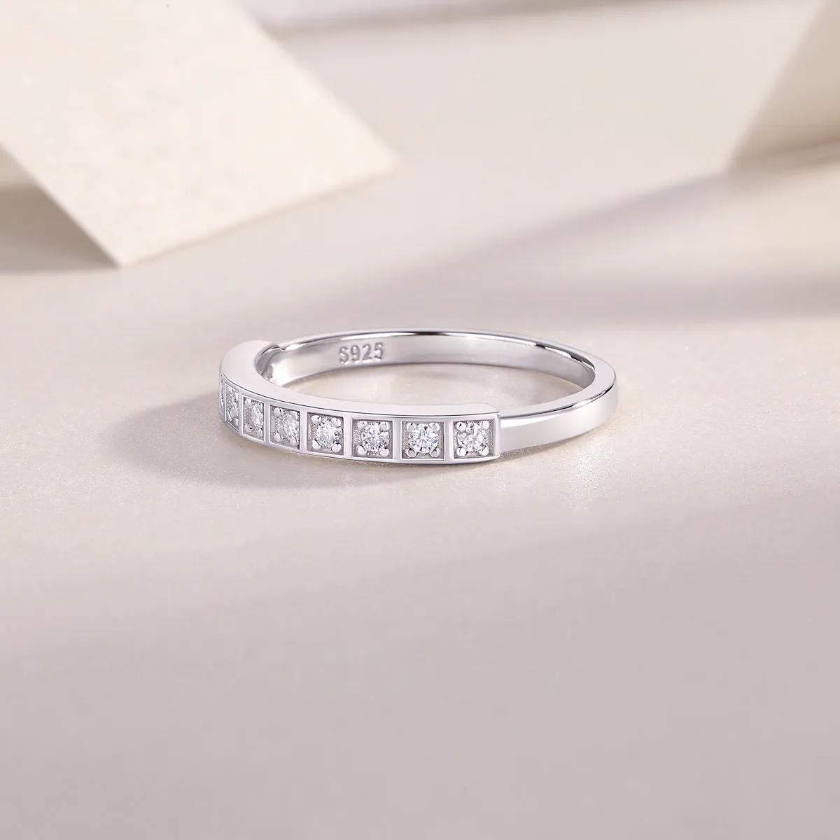 Moissanite wedding ring set on white background, S925 silver platinum plated, less than 0.1 carat stone