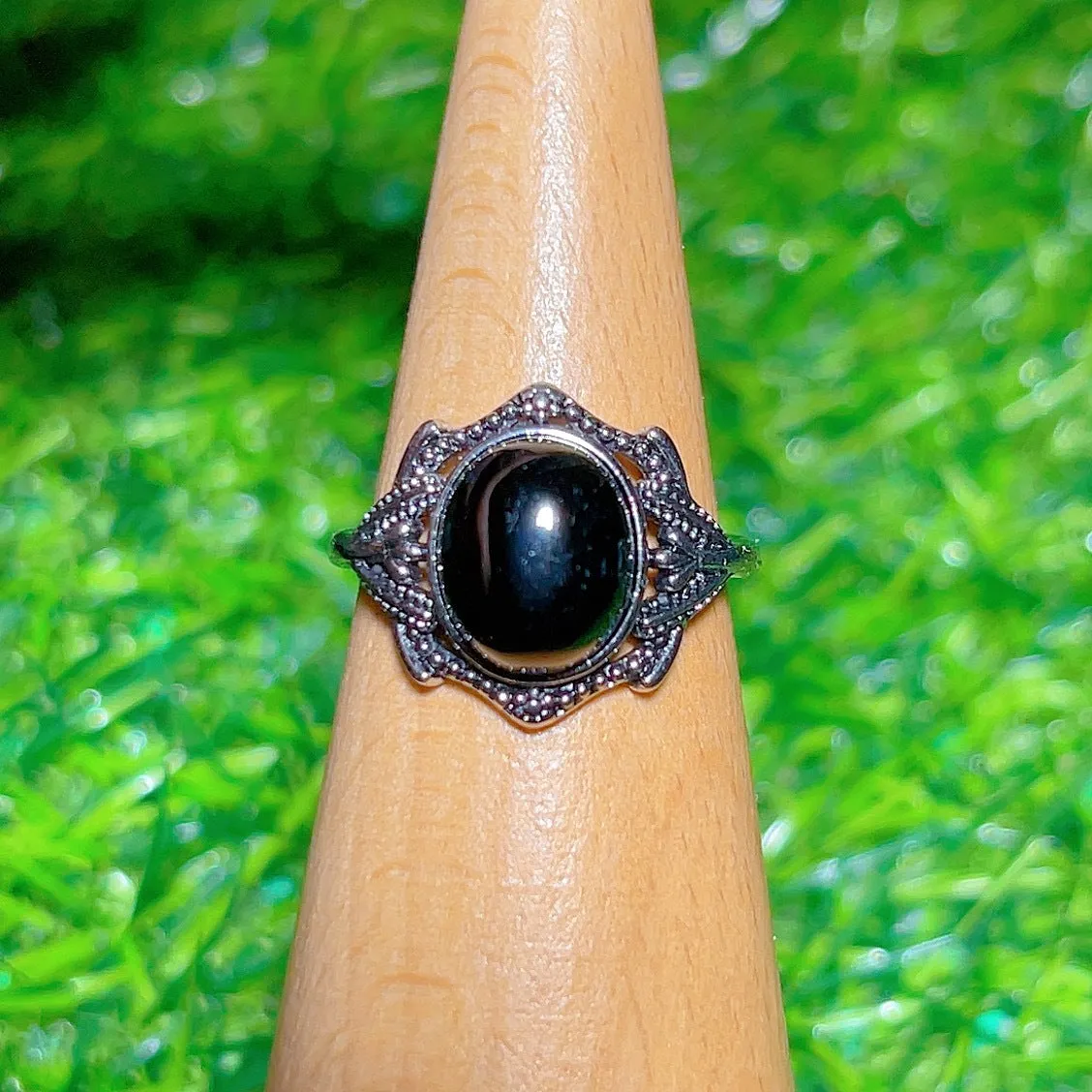 Copper open ring with crystal inlay, geometric shape, black tourmaline colour, on white background