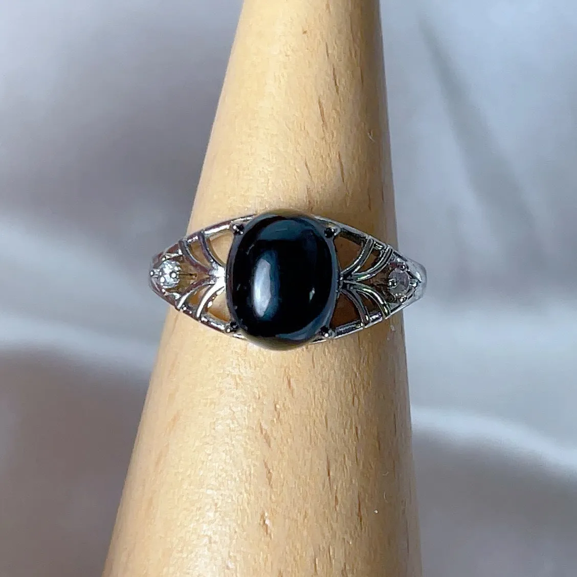Copper open ring with crystal inlay, geometric shape, black tourmaline colour, on white background