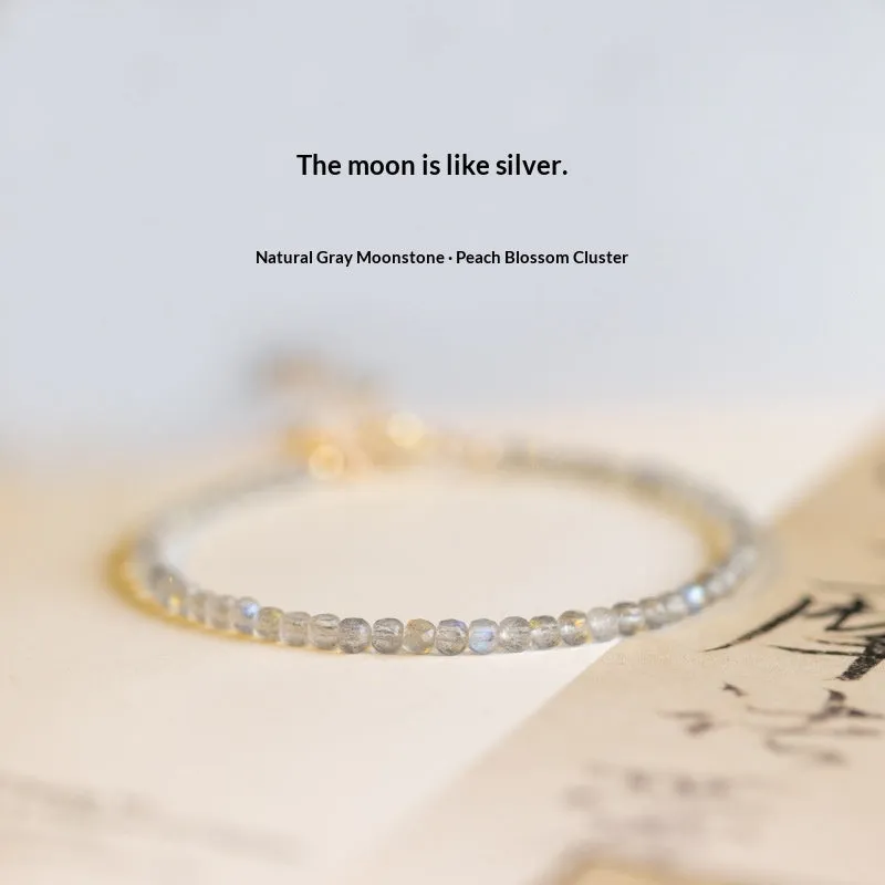Natural gray moonstone diamond-shaped beads on a silver bracelet with clasp