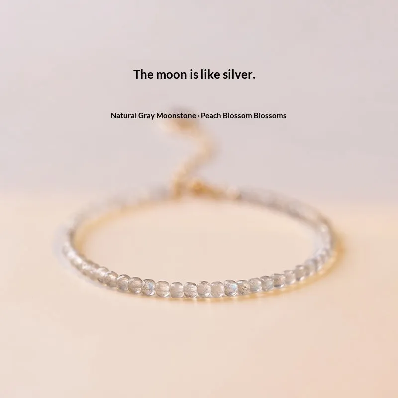 Natural gray moonstone diamond-shaped beads on a silver bracelet with clasp