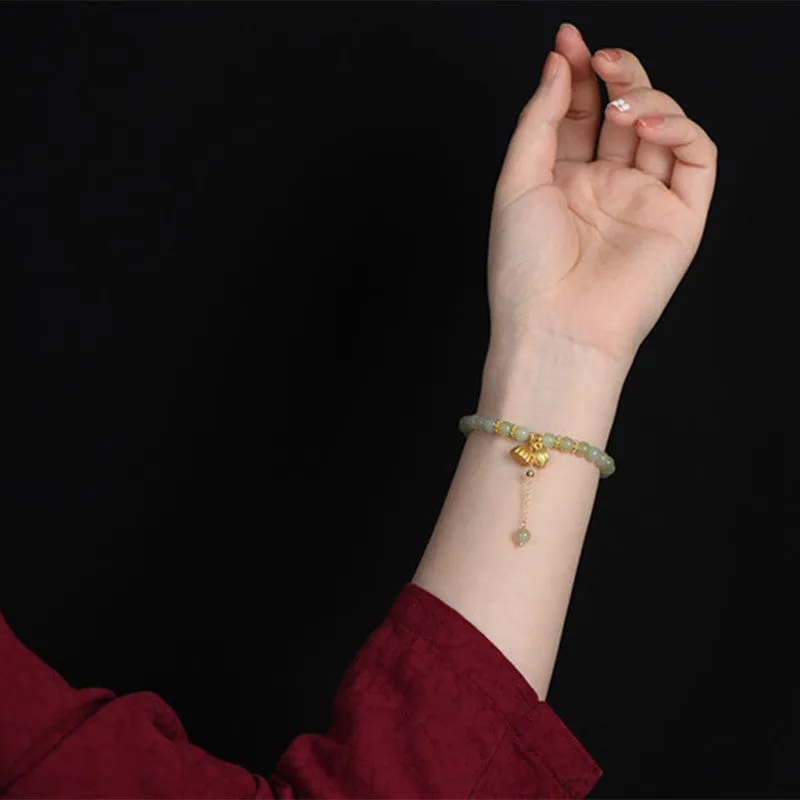 Natural Hetian jade bracelet with lotus carving and fu symbols on 6mm beads