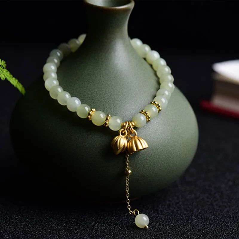 Natural Hetian jade bracelet with lotus carving and fu symbols on 6mm beads