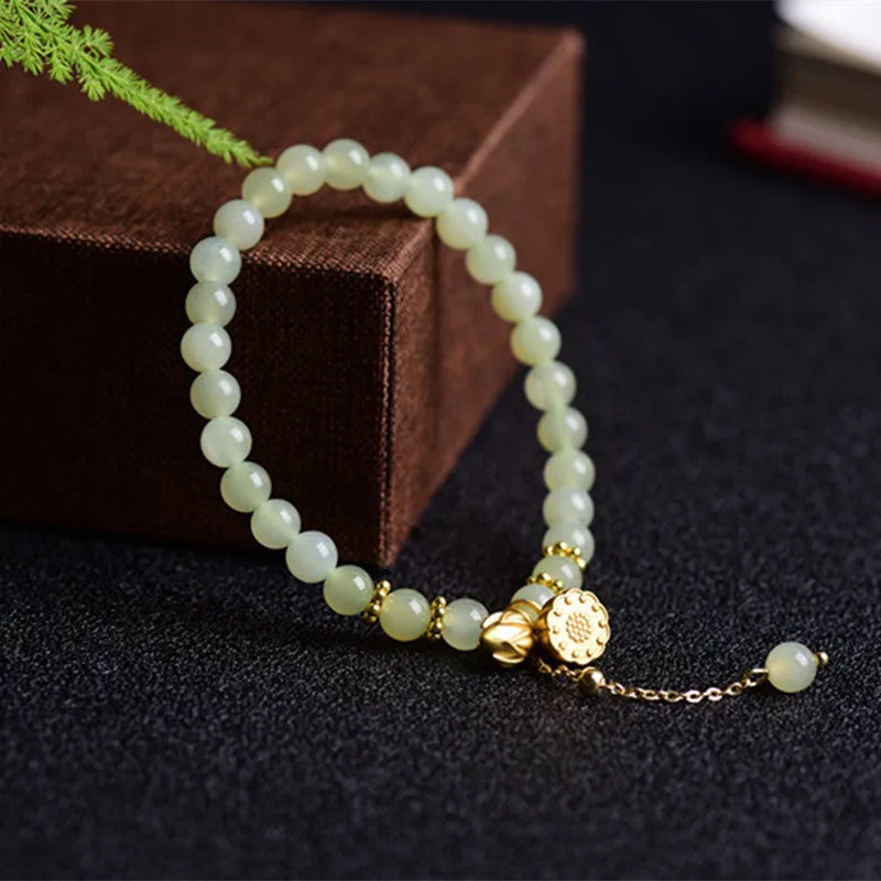 Natural Hetian jade bracelet with lotus carving and fu symbols on 6mm beads