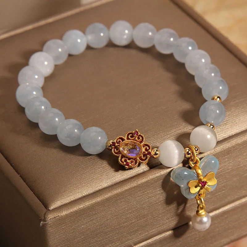 Aquamarine butterfly pendant crystal bracelet for women with rhinestone details on silver chain.