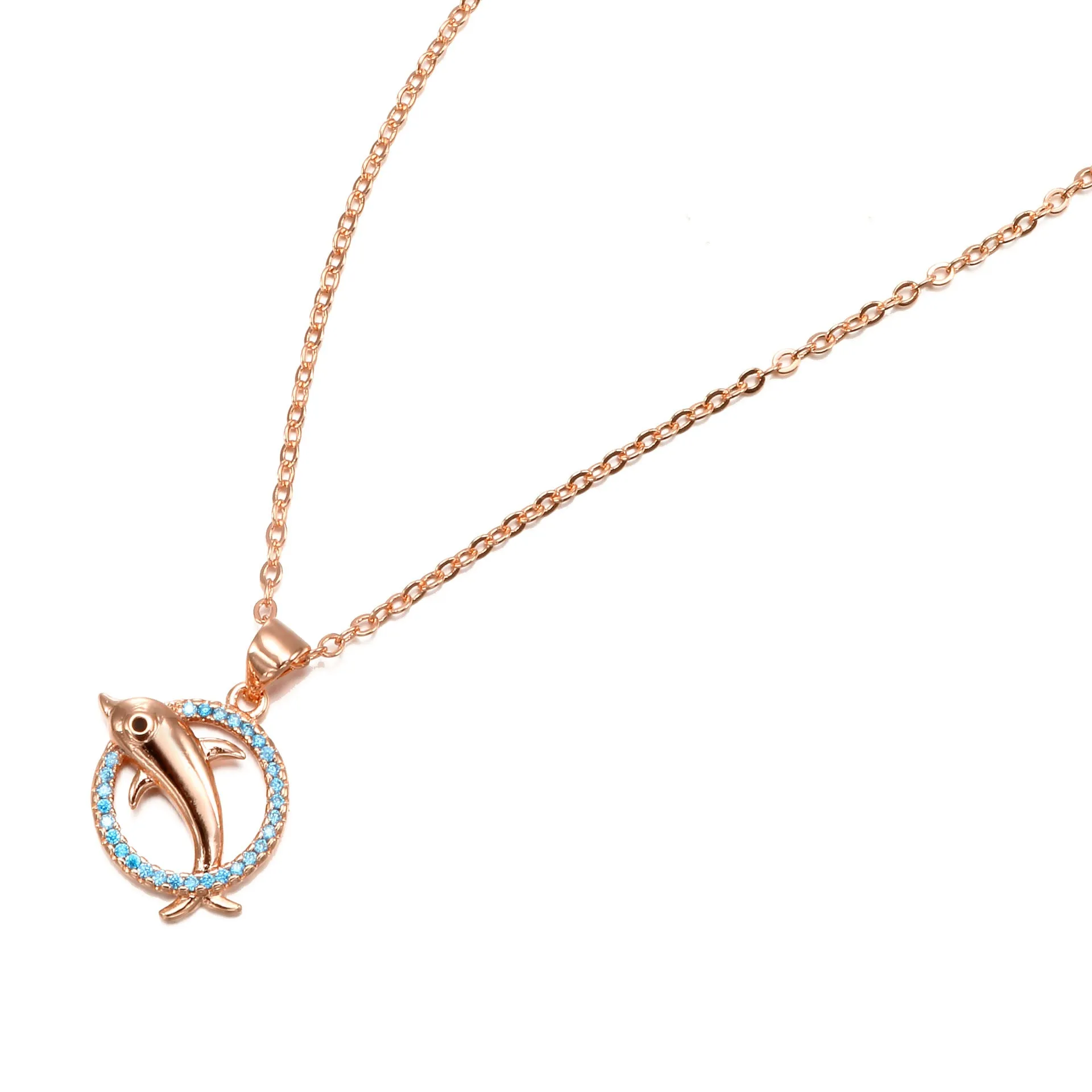 Romantic copper dolphin pendant necklace in rose gold on white background