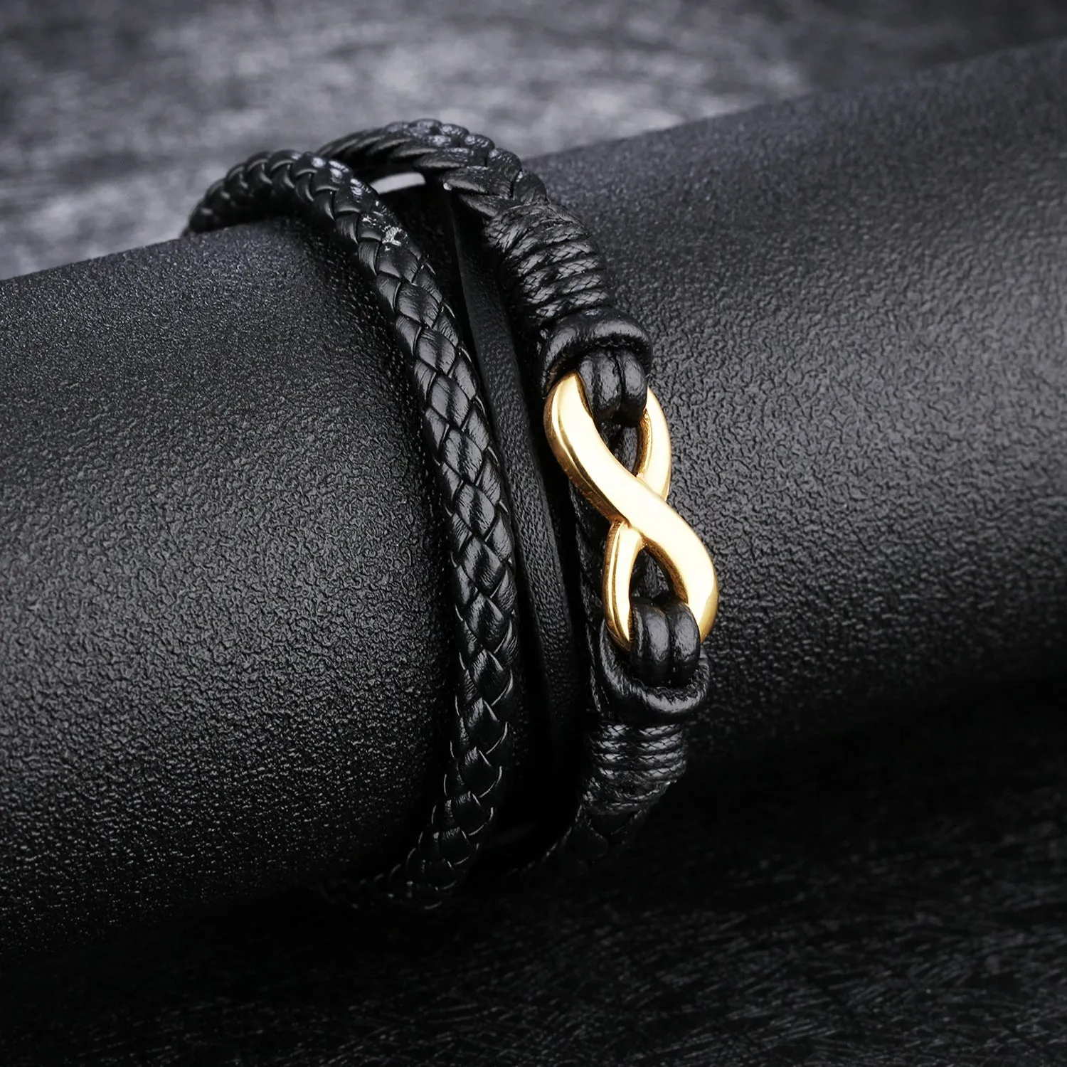 Black vintage leather bracelet with titanium steel clasp on display, 20cm length