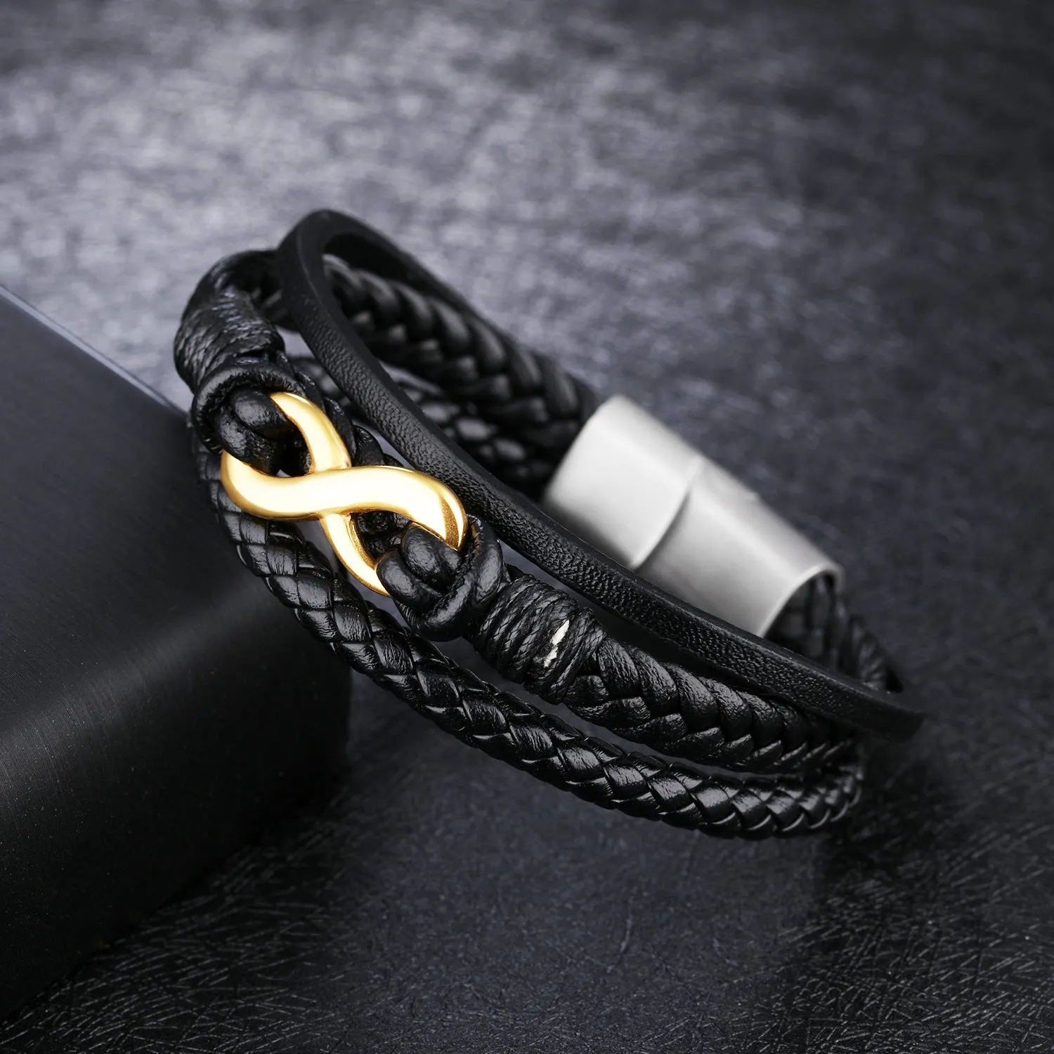 Black vintage leather bracelet with titanium steel clasp on display, 20cm length