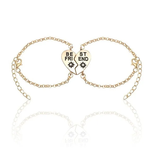 Heart shape alloy bracelet with dripping oil finish and inlaid gems in gold and silver colours