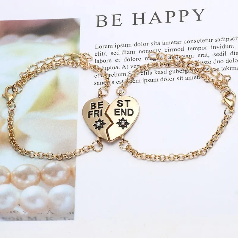 Heart shape alloy bracelet with dripping oil finish and inlaid gems in gold and silver colours