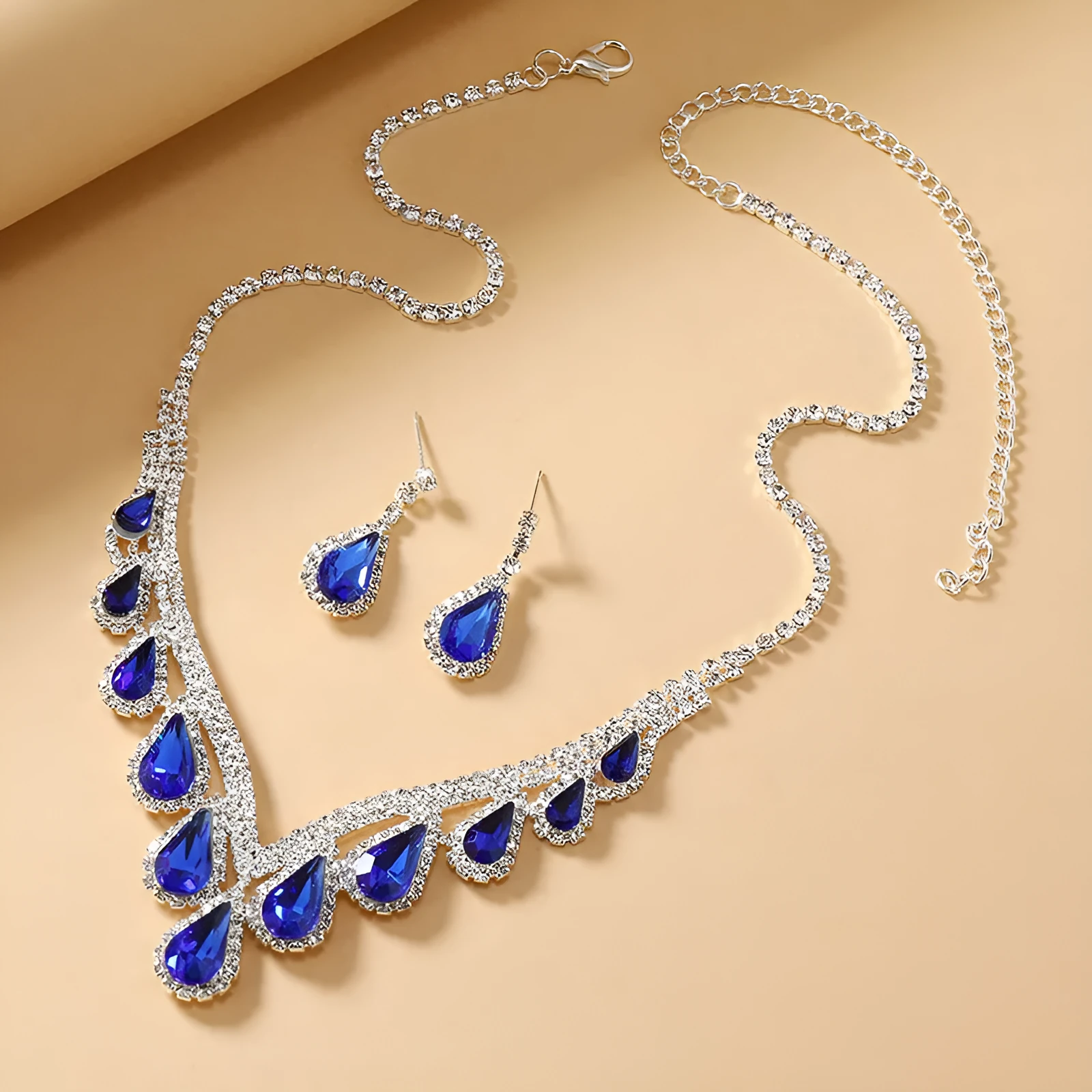 Royal Blue White K alloy jewellery set with a regular chain necklace and earrings on display