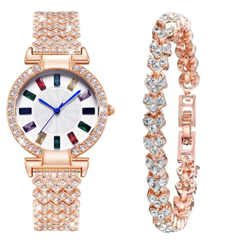 Gold quartz bracelet watch with round dial and alloy band on white background