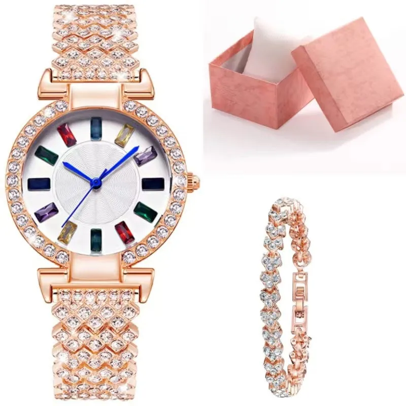 Gold quartz bracelet watch with round dial and alloy band on white background