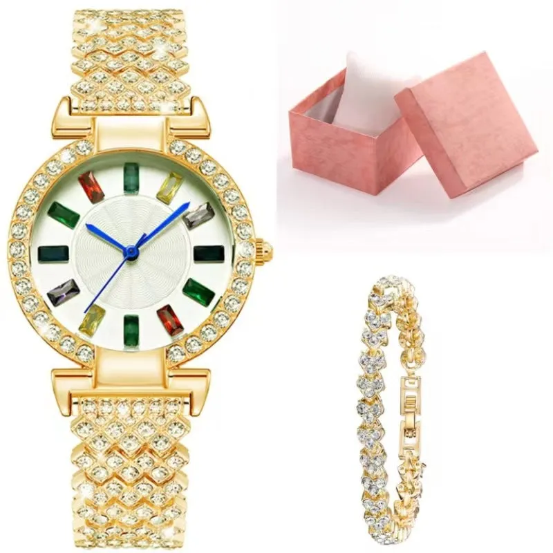Gold quartz bracelet watch with round dial and alloy band on white background