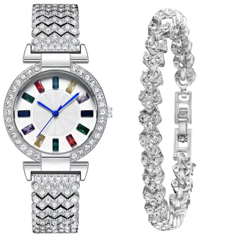 Gold quartz bracelet watch with round dial and alloy band on white background