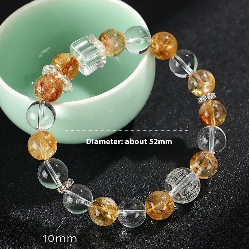 Handmade women's bracelet with white crystal beads, freshwater pearls, and yellow crystal accents