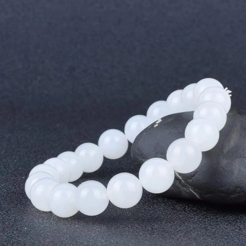 Hotan white jade goat fat round bead bracelet 10mm Hetian jade unisex national style on light background