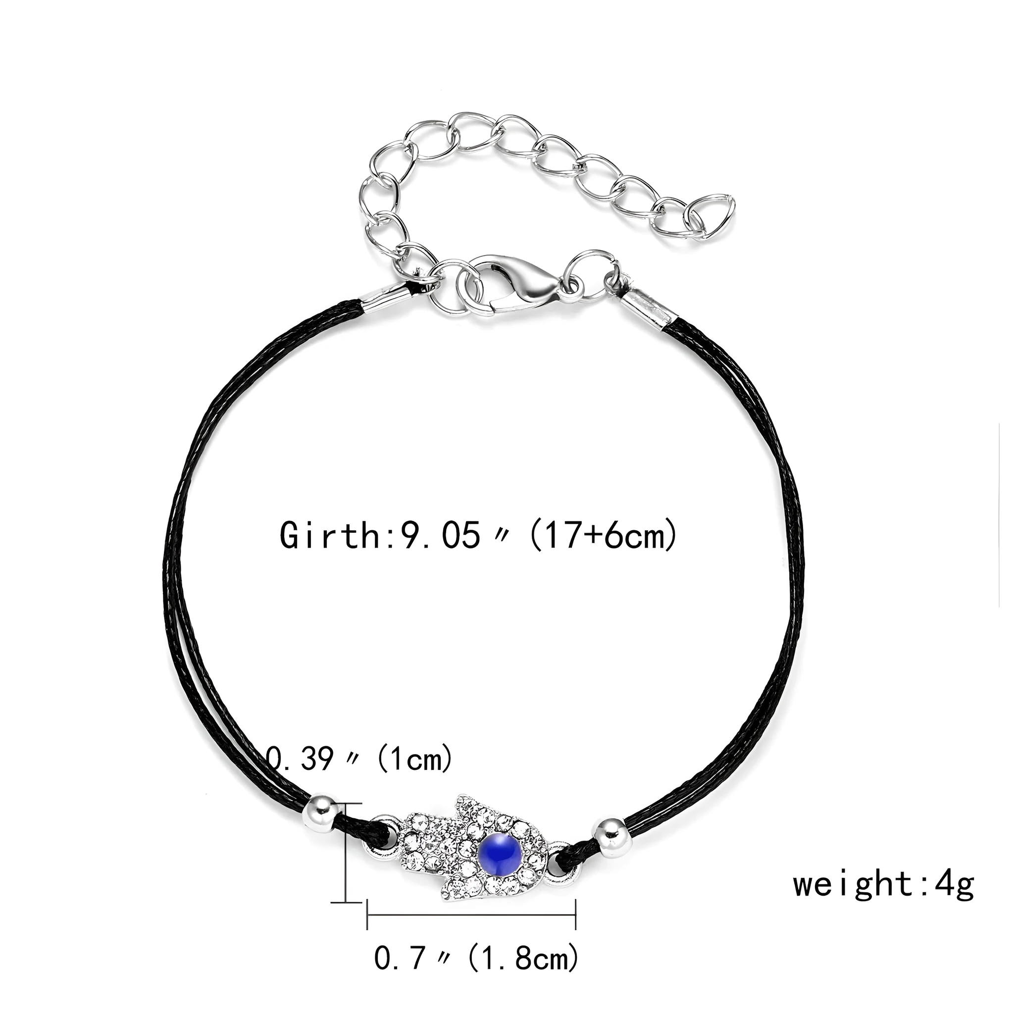 Handmade black string bracelet with evil eye charm and blue beads on a white background