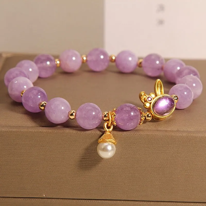Natural mauve jade hare head crystal bracelet in Mori style with purplish red accents.