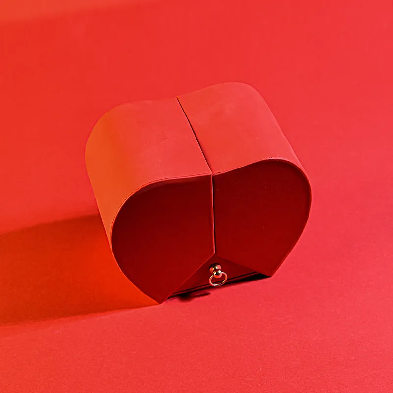 Red eternal rose necklace in apple-shaped jewellery gift box on display
