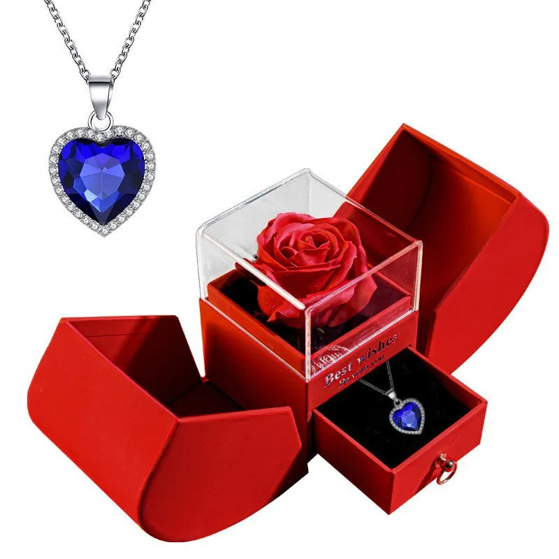 Red eternal rose necklace in apple-shaped jewellery gift box on display