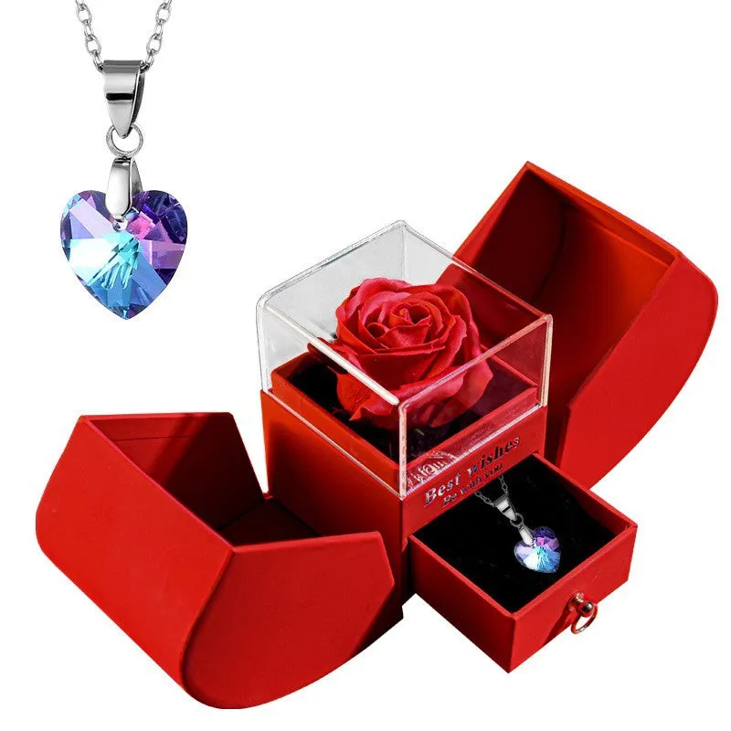 Red eternal rose necklace in apple-shaped jewellery gift box on display