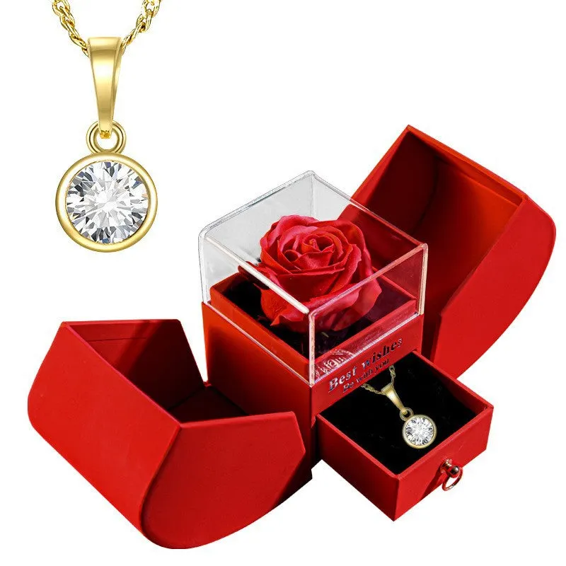Red eternal rose necklace in apple-shaped jewellery gift box on display