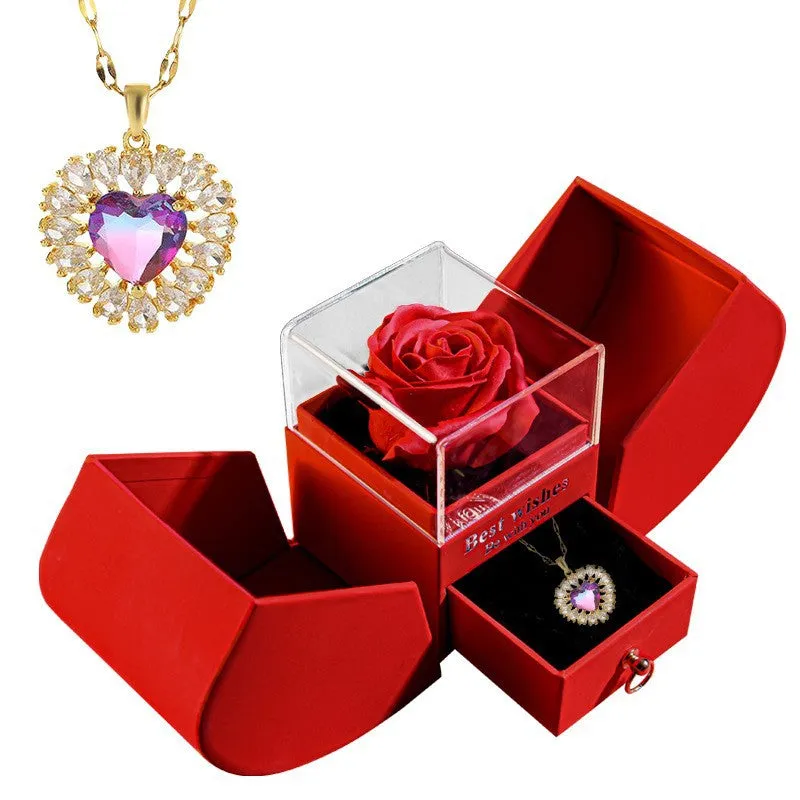 Red eternal rose necklace in apple-shaped jewellery gift box on display
