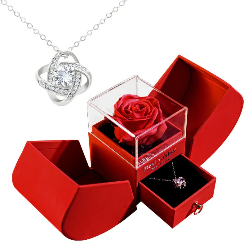 Red eternal rose necklace in apple-shaped jewellery gift box on display