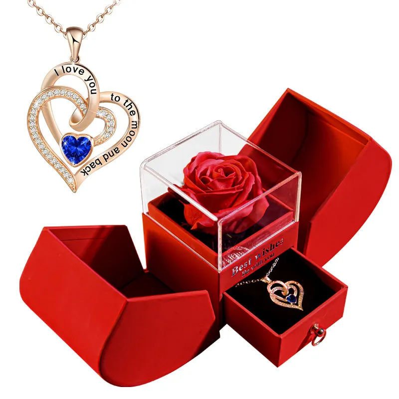 Red eternal rose necklace in apple-shaped jewellery gift box on display