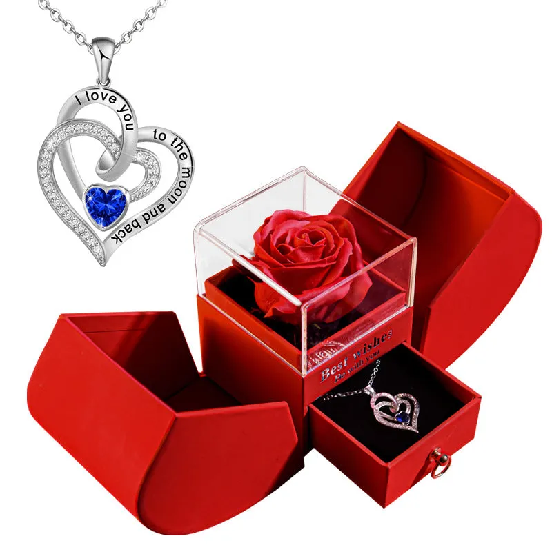 Red eternal rose necklace in apple-shaped jewellery gift box on display