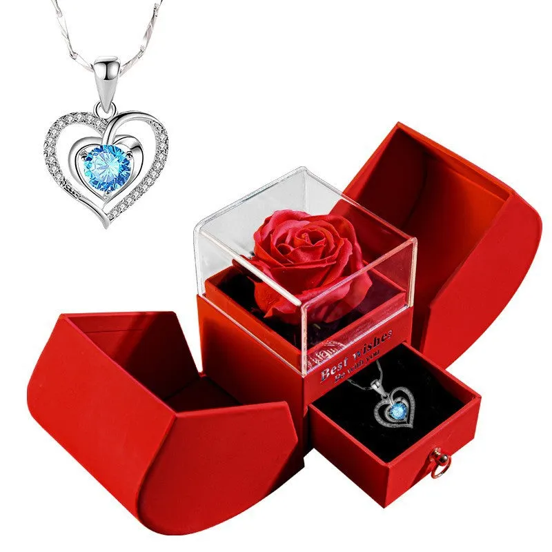Red eternal rose necklace in apple-shaped jewellery gift box on display