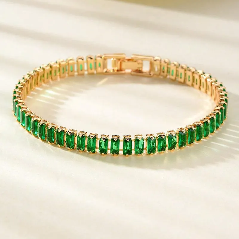 Unisex gold electroplated double-row diamond zirconia tennis chain bracelet on white background