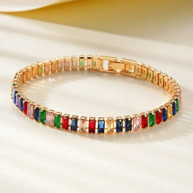 Unisex gold electroplated double-row diamond zirconia tennis chain bracelet on white background