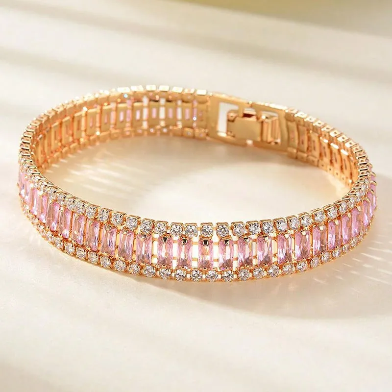Unisex gold electroplated double-row diamond zirconia tennis chain bracelet on white background
