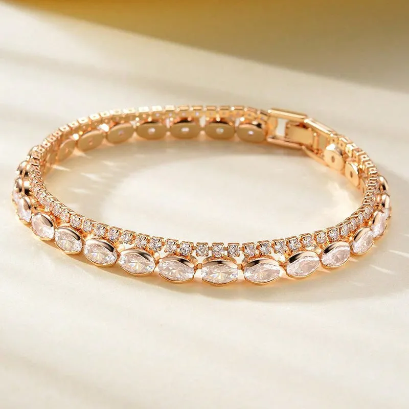 Unisex gold electroplated double-row diamond zirconia tennis chain bracelet on white background