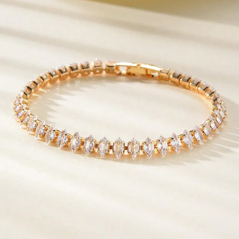 Unisex gold electroplated double-row diamond zirconia tennis chain bracelet on white background