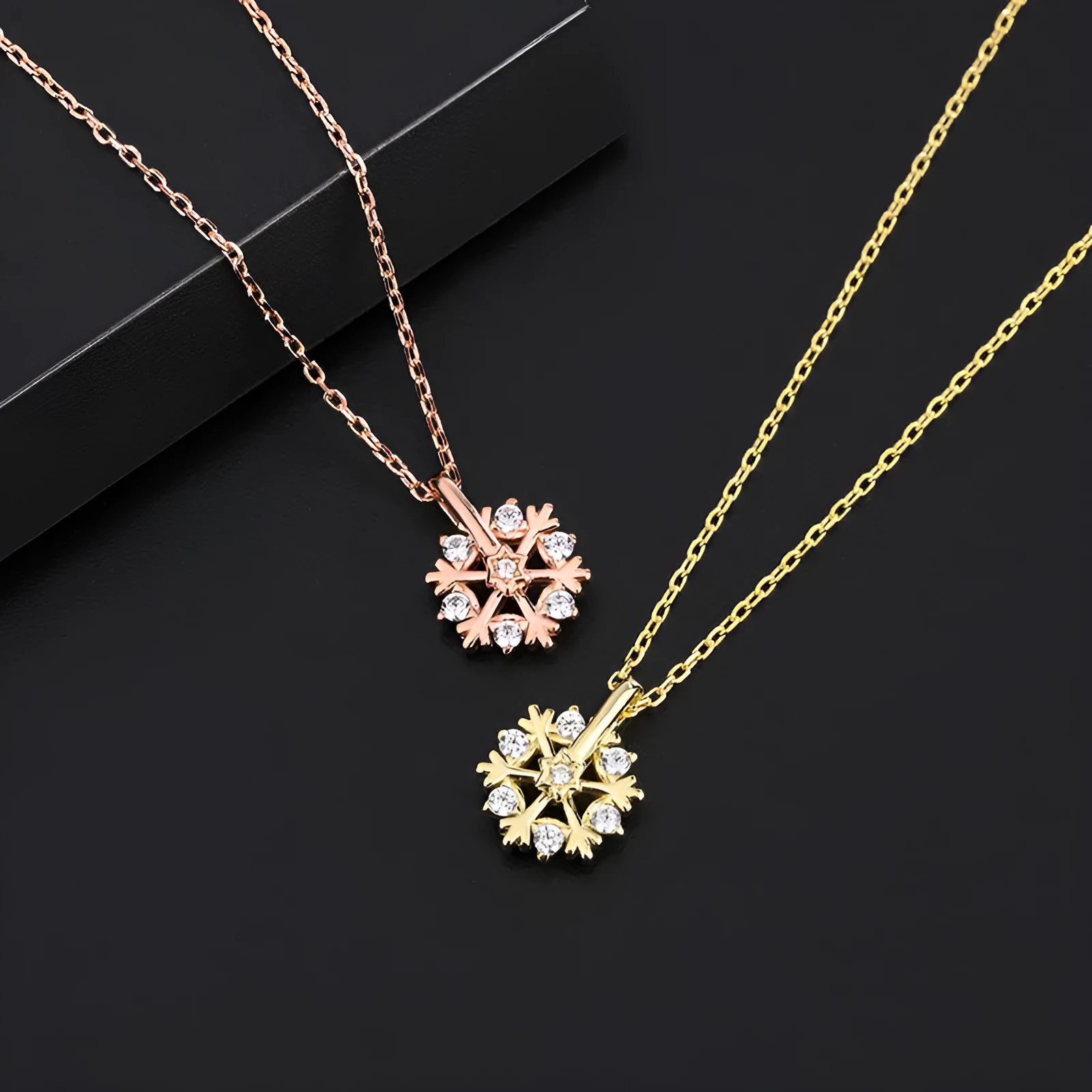 Pure silver rotating snowflake necklace with electroplated finish on adjustable cross chain for women