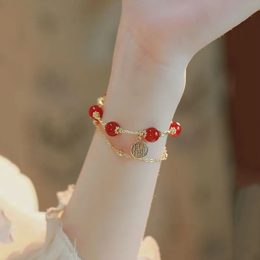 Red agate and alloy double-layer women's bracelet with Hongma lucky charm pendant on wrist