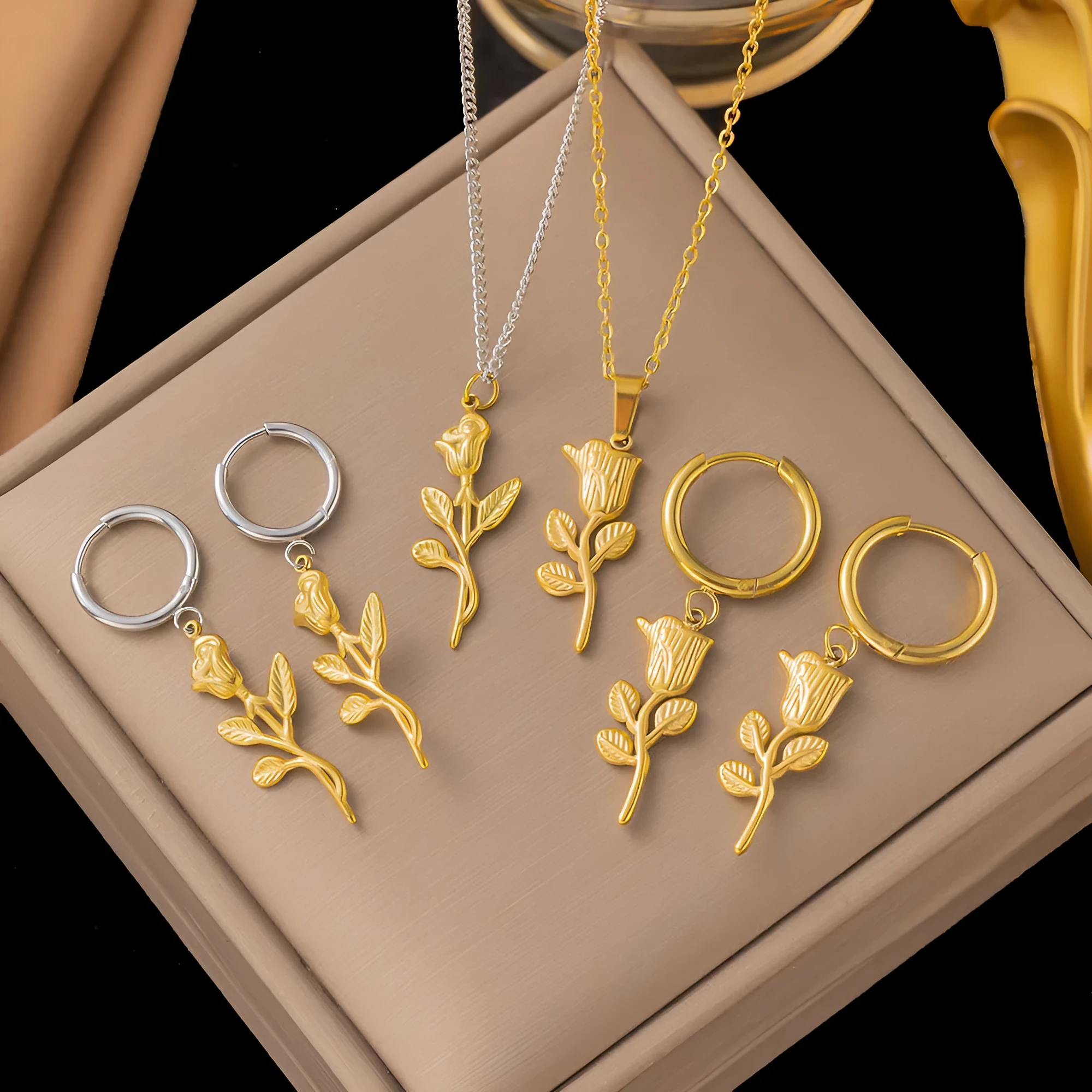 Titanium steel rose necklace set in gold with matching earrings on O-link chain, simple sweet style