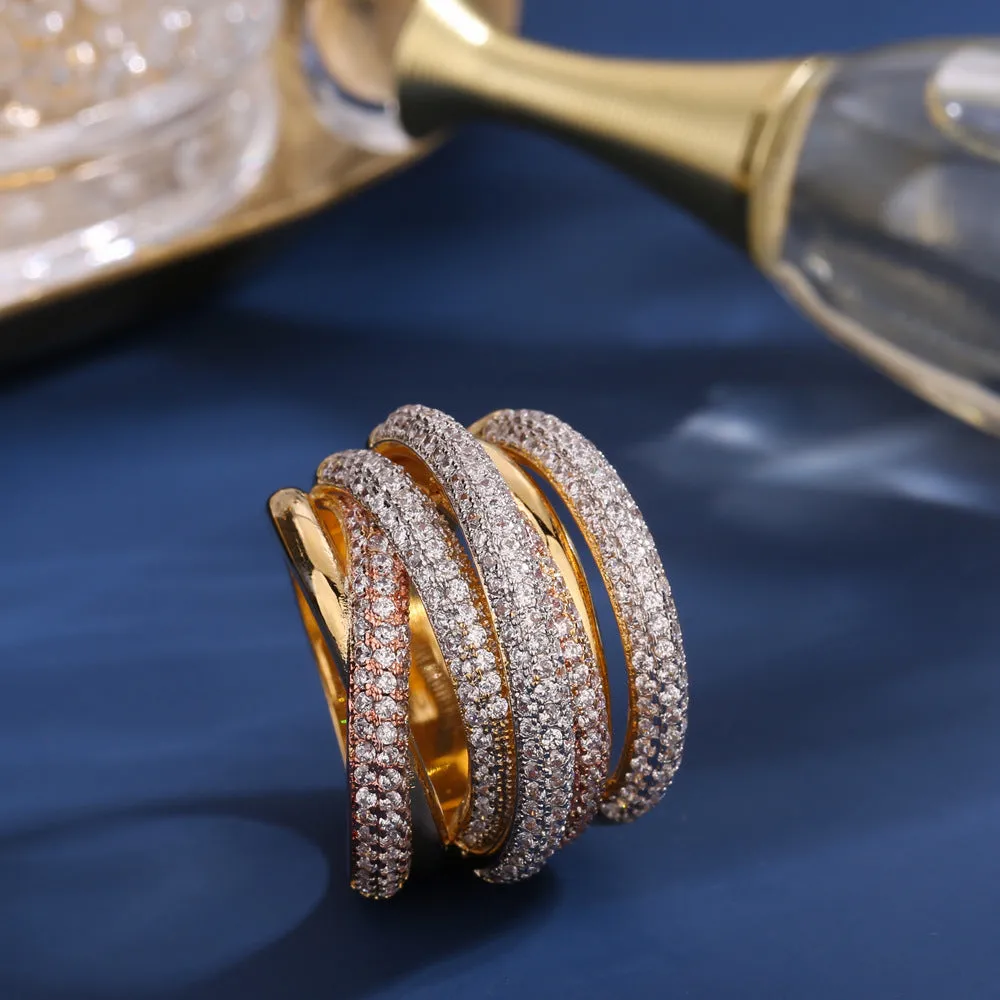 Women's geometric cross line ring with colour-separated zirconia stones in green, red, yellow, purple on a copper band