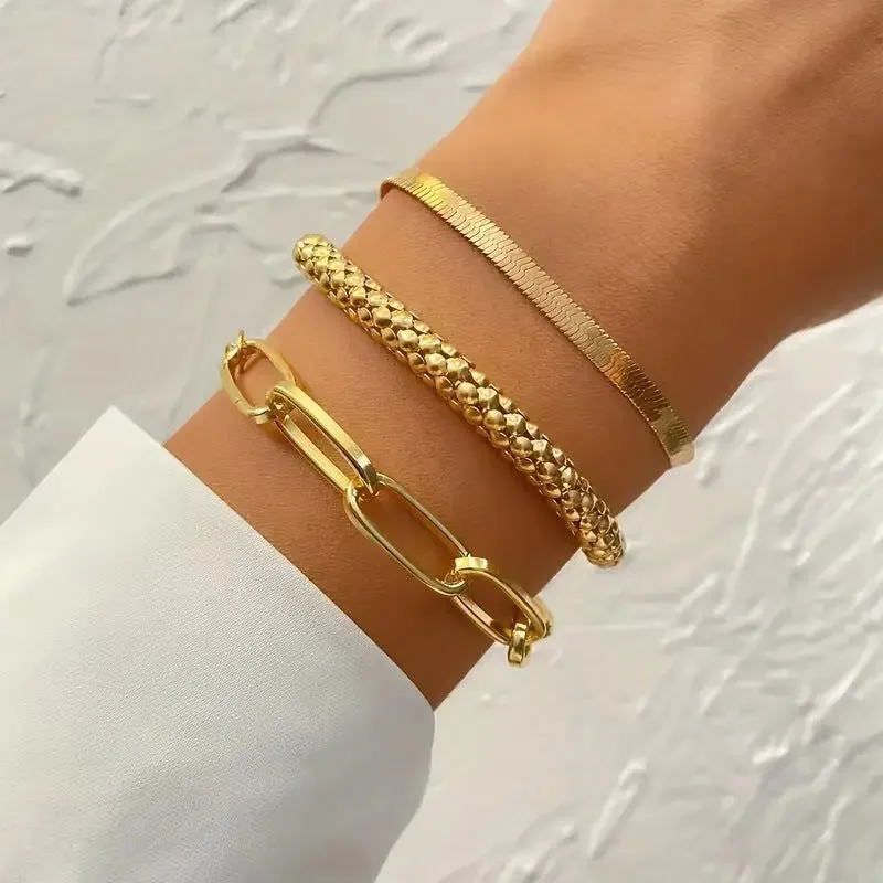 Set of three alloy snake bone chain bracelets in retro geometric design with electroplated gold finish