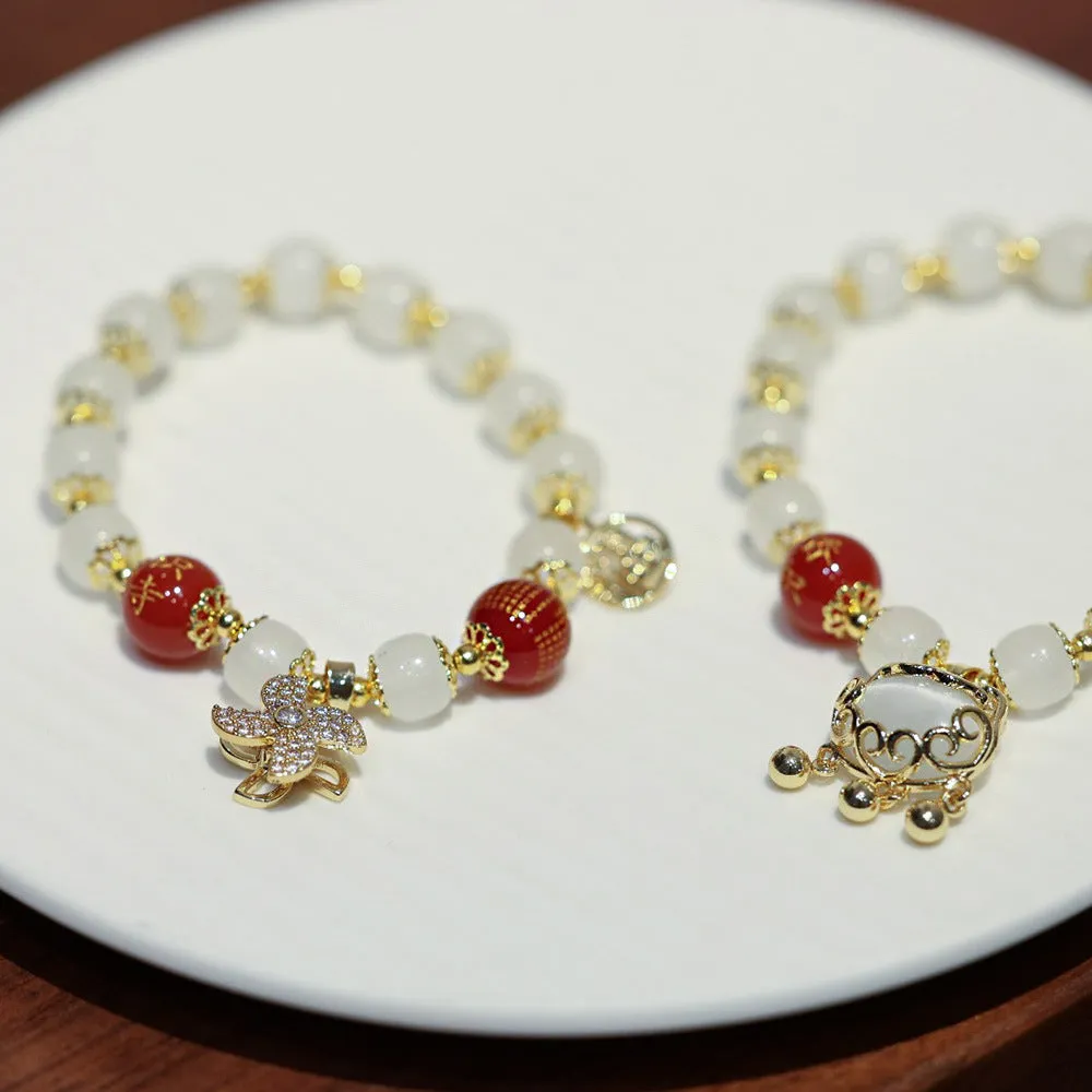 Women's Chinese style glass bracelet with safety lock, fu character, windmill, bamboo, and jade charm elements